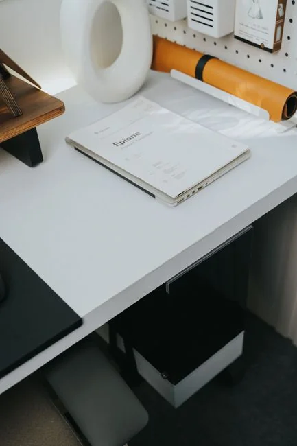 Group of designers collaborating in modern office space with computer.